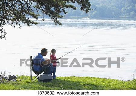 Stock Image - a father and daughter fishing together. Fotosearch