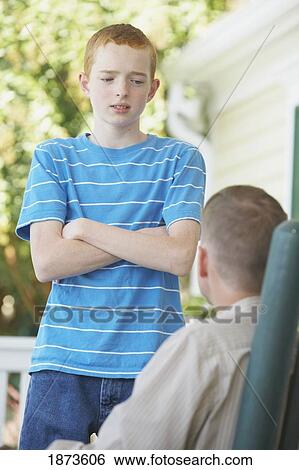 a father and son talking View Large Photo Image Stock Photograph - a father and son talking. Fotosearch