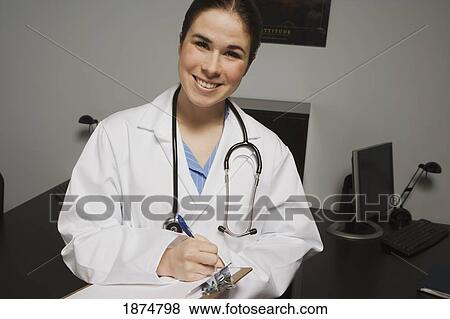 a female doctor in an office View Large Photo Image Stock Photo - a female doctor in an office. Fotosearch