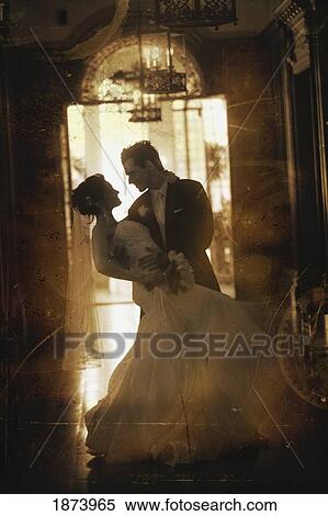 a groom holding his bride View Large Photo Image Stock Photography - a groom holding his bride. Fotosearch