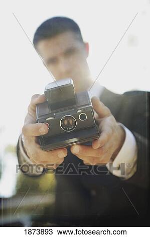a man in formal wear taking a self portrait with a camera View Large Photo Image Stock Image - a man in formal wear taking a self portrait with a camera. Fotosearch