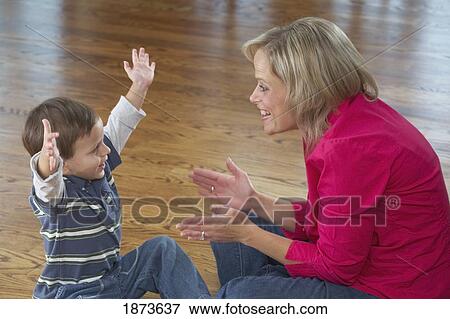 Stock Photo - a mother playing with her young son. Fotosearch