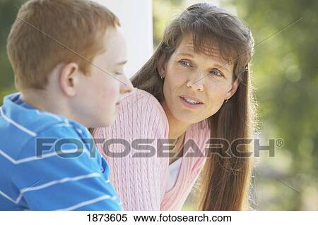 Stock Photography - a mother talking to her son. Fotosearch