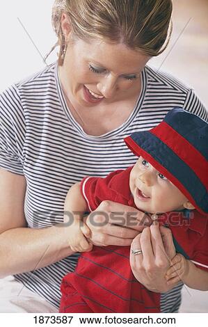 Stock Photo - a mother with her baby boy. Fotosearch