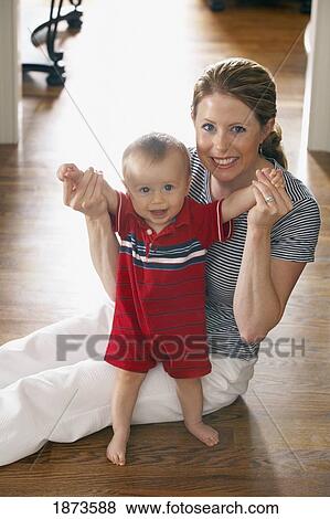Stock Photo - a mother with her baby son. Fotosearch