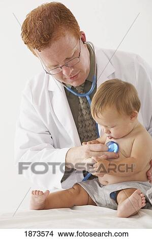 a pediatrician examining a baby View Large Photo Image Picture - a pediatrician examining a baby. Fotosearch
