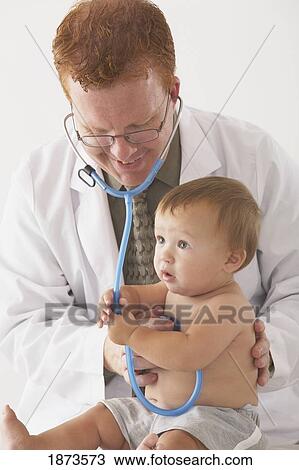 Stock Image - a pediatrician examining a baby. Fotosearch