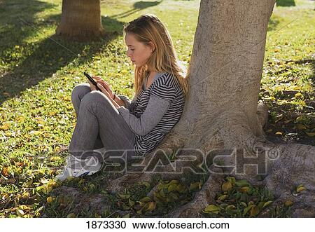 a teenage girl using a cellphone View Large Photo Image Stock Image - a teenage girl using a cellphone. Fotosearch