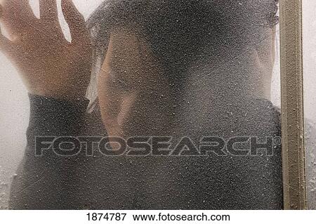 a woman behind a cold, frosted window View Large Photo Image Stock Photo - a woman behind a cold, frosted window. Fotosearch