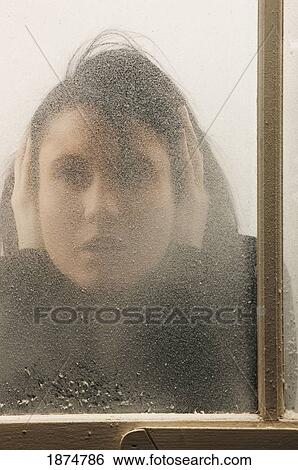 a woman behind a cold, frosted window View Large Photo Image Stock Photograph - a woman behind a cold, frosted window. Fotosearch