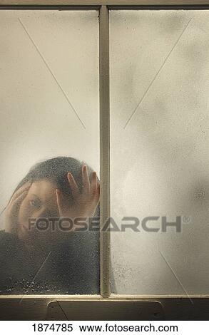 a woman behind a cold, frosted window View Large Photo Image Stock Photography - a woman behind a cold, frosted window. Fotosearch