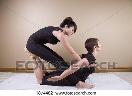 a woman getting a thai massage View Large Photo Image Stock Image - a woman getting a thai massage. Fotosearch