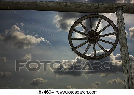 alberta, canada; a wagon wheel and an old fence View Large Photo Image Picture - alberta, canada; a wagon wheel and an old fence. Fotosearch