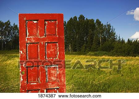 alberta, canada; an old, worn red door in a field View Large Photo Image Stock Photo - alberta, canada; an old, worn red door in a field. Fotosearch
