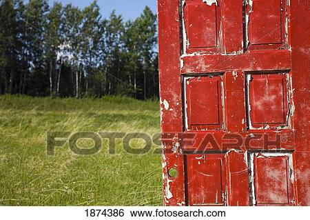 alberta, canada; an old, worn red door in a field View Large Photo Image Stock Photograph - alberta, canada; an old, worn red door in a field. Fotosearch