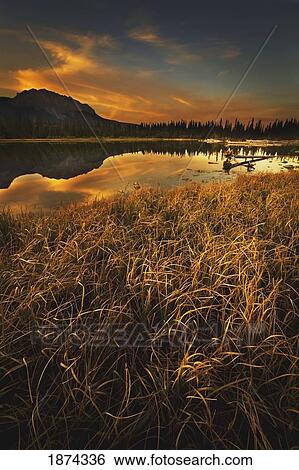 alberta, canada; sunset over a lake and mountains View Large Photo Image Stock Photograph - alberta, canada; sunset over a lake and mountains. Fotosearch