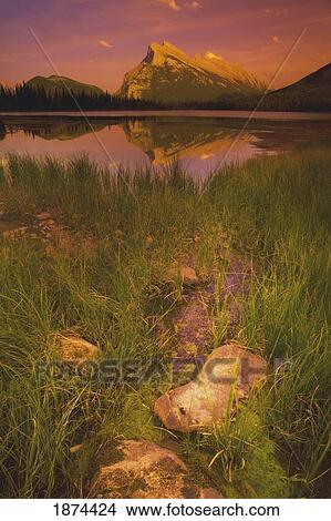 banff, alberta, canada; a mountain lake during a sunset View Large Photo Image Picture - banff, alberta, canada; a mountain lake during a sunset. Fotosearch
