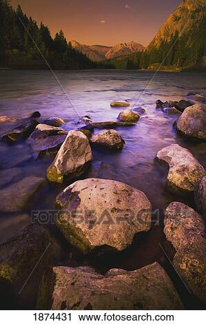 banff, alberta, canada; rocks in a mountain river at sunset View Large Photo Image Stock Image - banff, alberta, canada; rocks in a mountain river at sunset. Fotosearch