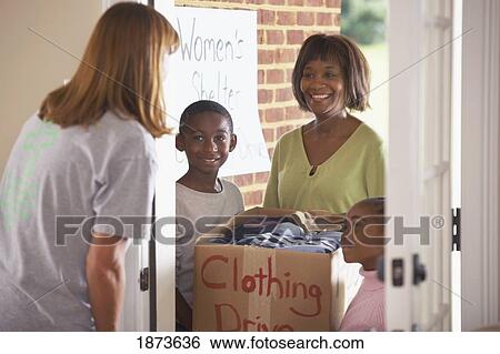 Stock Photograph - collecting clothes for a clothing drive. Fotosearch