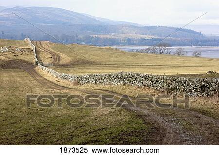 dumfries, scotland; a stone fence along a road View Large Photo Image Stock Photography - dumfries, scotland; a stone fence along a road. Fotosearch