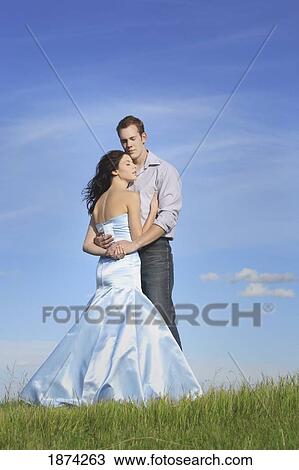 Stock Image - edmonton, alberta, canada; a man and woman in an embrace. Fotosearch