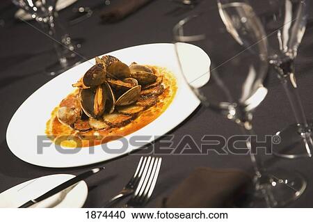 edmonton, alberta canada; a plate of seafood on a table with wine glasses View Large Photo Image Stock Image - edmonton, alberta canada; a plate of seafood on a table with wine glasses. Fotosearch