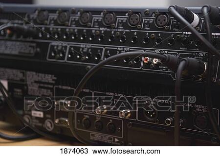 Stock Image - edmonton, alberta, canada; jacks plugged in to the back of a sound board. Fotosearch