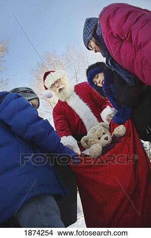 edmonton, alberta, canada; santa claus being caught with a sack full of toys View Large Photo Image Picture - edmonton, alberta, canada; santa claus being caught with a sack full of toys. Fotosearch