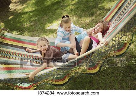 edmonton, alberta, canada; three girls playing in a hammock View Large Photo Image Picture - edmonton, alberta, canada; three girls playing in a hammock. Fotosearch