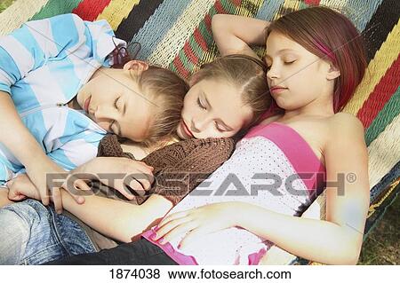 edmonton, alberta, canada; three girls sleeping on a hammock together View Large Photo Image Stock Photo - edmonton, alberta, canada; three girls sleeping on a hammock together. Fotosearch