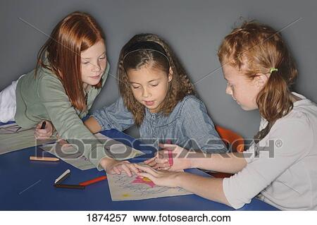 edmonton, alberta, canada; three girls coloring pictures at a table View Large Photo Image Stock Photo - edmonton, alberta, canada; three girls coloring pictures at a table. Fotosearch