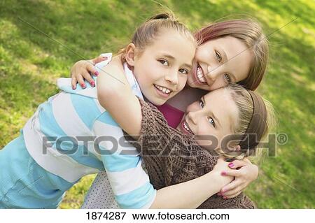 edmonton, alberta, canada; three girls in an embrace View Large Photo Image Stock Photo - edmonton, alberta, canada; three girls in an embrace. Fotosearch