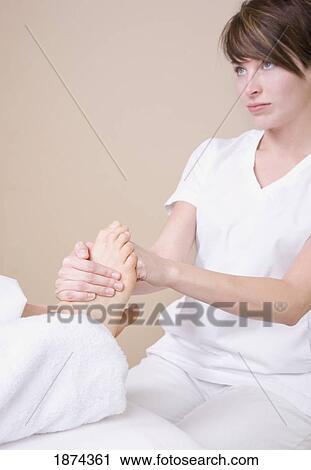 feet being massaged by a massage therapist View Large Photo Image Stock Image - feet being massaged by a massage therapist. Fotosearch