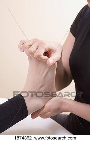 feet being massaged by a massage therapist View Large Photo Image Stock Image - feet being massaged by a massage therapist. Fotosearch