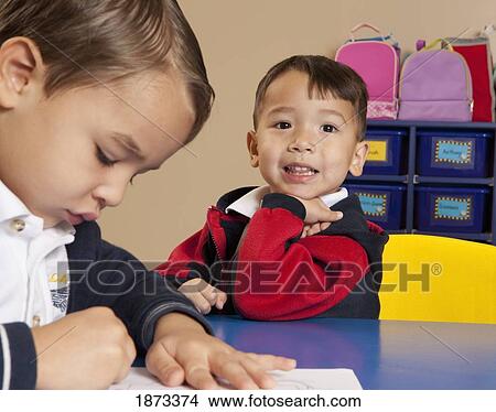 fort lauderdale, florida, united states of america; two young boys coloring at a table in a classroom View Large Photo Image Picture - fort lauderdale, florida, united states of america; two young boys coloring at a table in a classroom. Fotosearch
