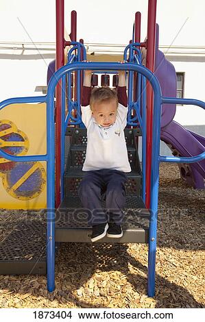 fort lauderdale, florida, united states of america; a young boy playing at a playground View Large Photo Image Picture - fort lauderdale, florida, united states of america; a young boy playing at a playground. Fotosearch