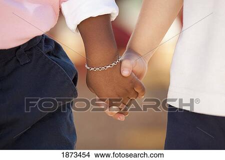 fort lauderdale, florida, united states of america; two children holding hands View Large Photo Image Picture - fort lauderdale, florida, united states of america; two children holding hands. Fotosearch