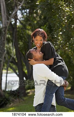 fort lauderdale, florida, united states of america; a couple having fun together in a park View Large Photo Image Picture - fort lauderdale, florida, united states of america; a couple having fun together in a park. Fotosearch