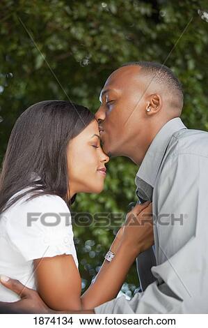 fort lauderdale, florida, united states of america; a couple holding each other close View Large Photo Image Picture - fort lauderdale, florida, united states of america; a couple holding each other close. Fotosearch