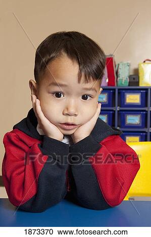 fort lauderdale, florida, united states of america; a young boy sitting at a table in a classroom View Large Photo Image Stock Image - fort lauderdale, florida, united states of america; a young boy sitting at a table in a classroom. Fotosearch