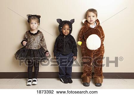 Stock Image - fort lauderdale, florida, united states of america; three young children dressed up in halloween costumes. Fotosearch