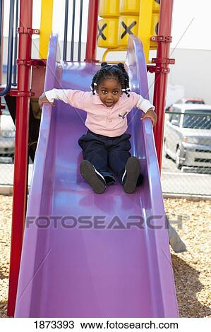 fort lauderdale, florida, united states of america; a young girl going down the slide at a playground View Large Photo Image Stock Image - fort lauderdale, florida, united states of america; a young girl going down the slide at a playground. Fotosearch