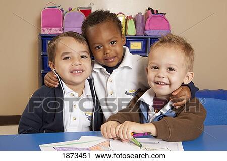 fort lauderdale, florida, united states of america; three young boys at a table in a classroom View Large Photo Image Stock Image - fort lauderdale, florida, united states of america; three young boys at a table in a classroom. Fotosearch