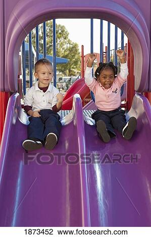 fort lauderdale, florida, united states of america; two young children going down the slide at a playground View Large Photo Image Stock Image - fort lauderdale, florida, united states of america; two young children going down the slide at a playground. Fotosearch