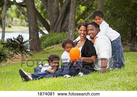 Stock Image - fort lauderdale, florida, united states of america; a family portrait in the park. Fotosearch