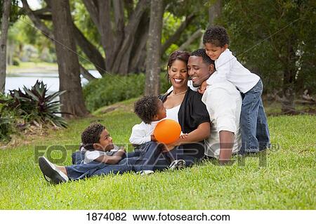 Stock Image - fort lauderdale, florida, united states of america; a family portrait in the park. Fotosearch