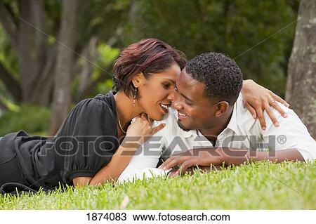 fort lauderdale, florida, united states of america; a couple laying on the grass in the park View Large Photo Image Stock Image - fort lauderdale, florida, united states of america; a couple laying on the grass in the park. Fotosearch