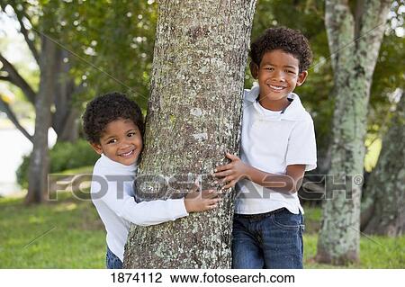 fort lauderdale, florida, united states of america; two boys standing by a tree View Large Photo Image Stock Image - fort lauderdale, florida, united states of america; two boys standing by a tree. Fotosearch