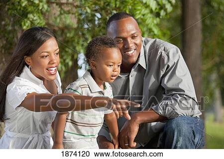 fort lauderdale, florida, united states of america; a father and mother pointing at something for their young son to see View Large Photo Image Stock Image - fort lauderdale, florida, united states of america; a father and mother pointing at something for their young son to see. Fotosearch