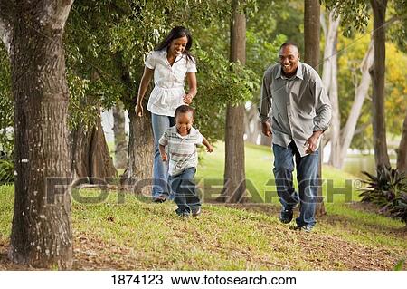 fort lauderdale, florida, united states of america; a father and mother chasing their young son through a park View Large Photo Image Stock Image - fort lauderdale, florida, united states of america; a father and mother chasing their young son through a park. Fotosearch